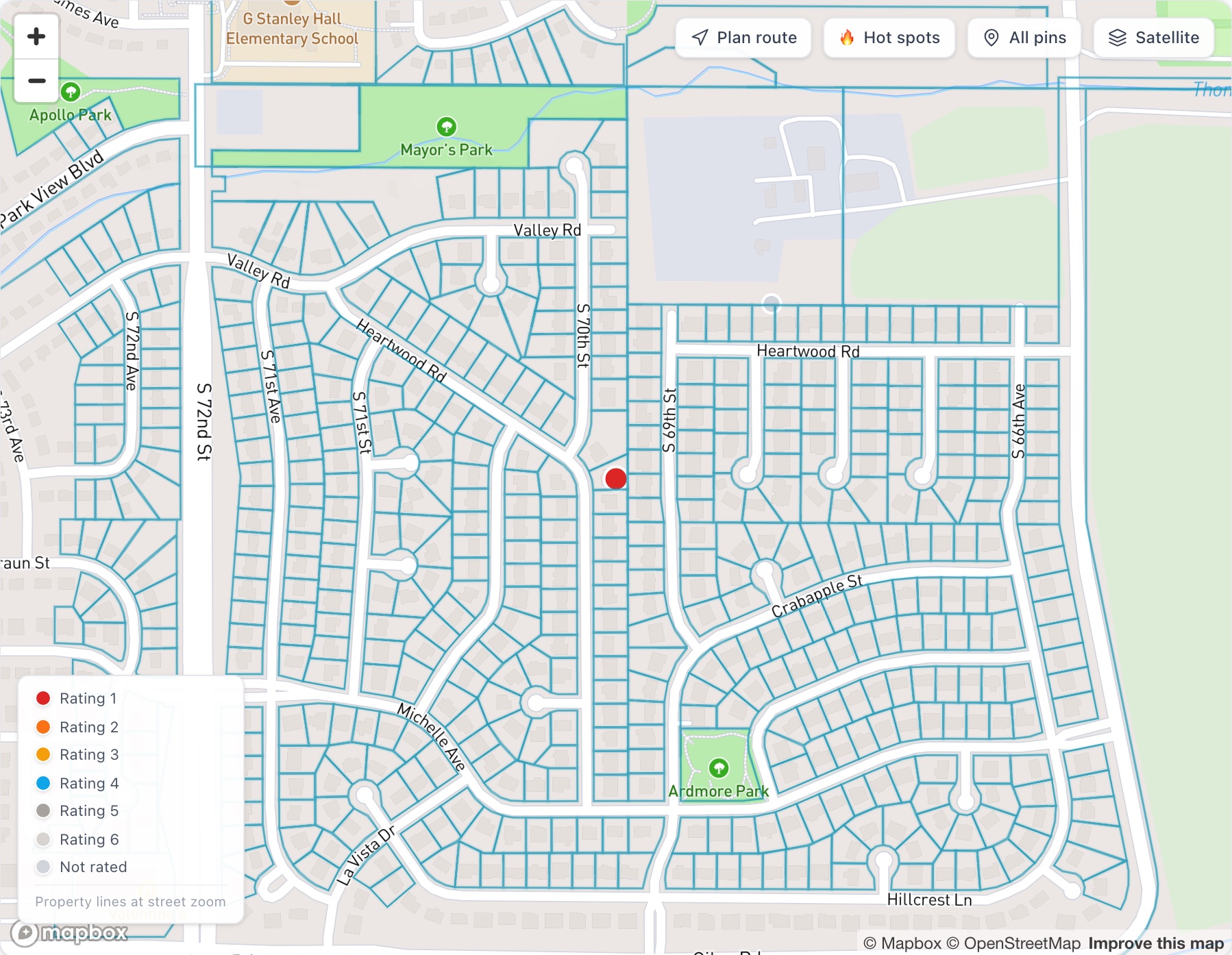 Street zoom with county parcel lines drawn around every lot and one request pinned